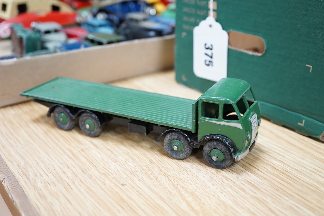 Twenty-seven Dinky Toys and Tri-ang Minic clockwork tinplate vehicles, including Dinky 38 and 39 series British and American cars, a Foden DG flatbed, a Tri-ang Minic double deck London Transport bus, two refuse wagons,